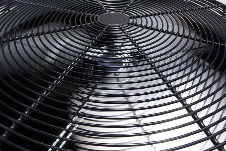 The top fan component of an AC system showing one of the things to consider when learning how to properly size your unit.