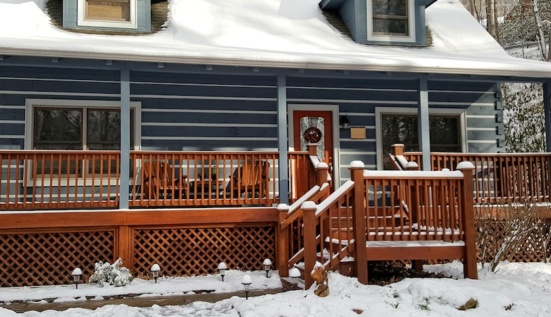 Cozy cabin in North Carolina after snow fall.